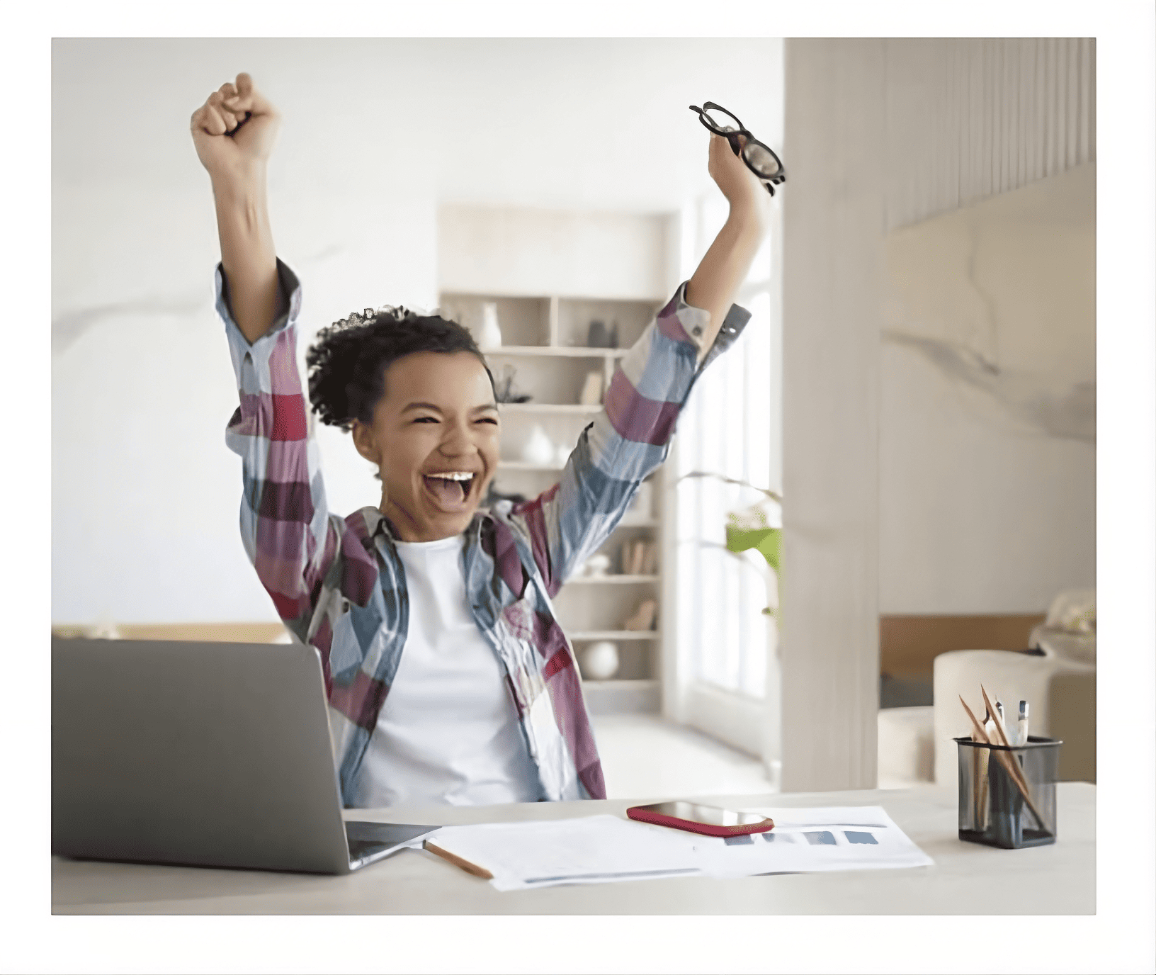 Happy student reading college-acceptance email.